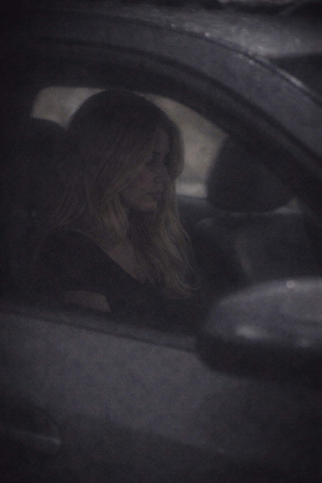 Surveillance still — subject observed in vehicle